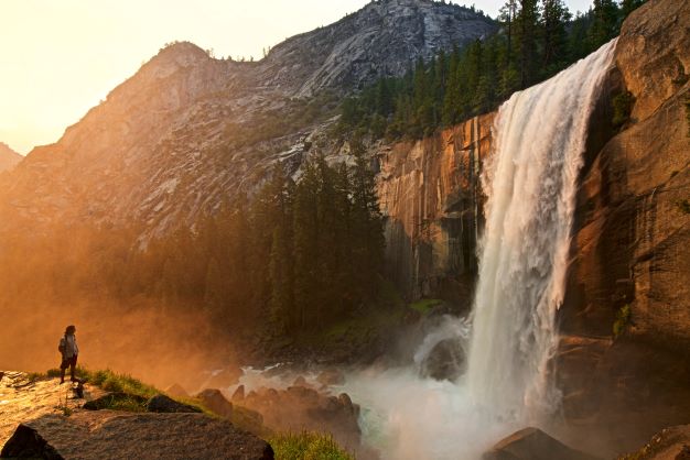 Man by waterfall